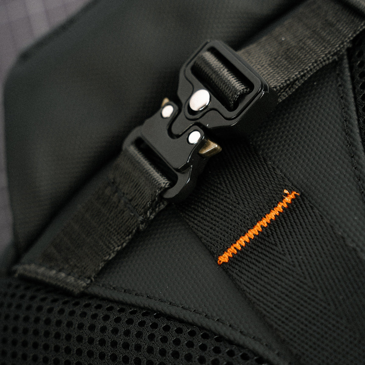 The cobra buckle on the SMORK click-mount system — Stealth Black and Pearl White